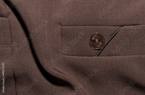Pocket on women's clothing, brown trousers. Part of women's clothing or accessory