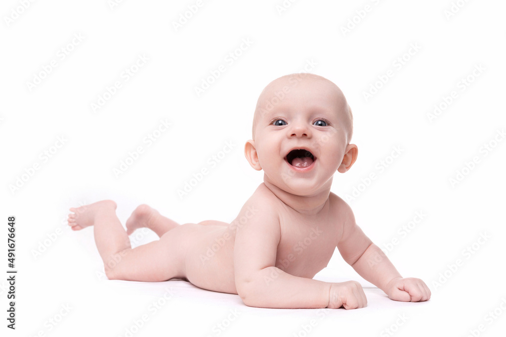 naked cute baby with a smile on his face looks at the camera on an isolated white background naked cute baby with a smile on his face looks at the camera on an isolated white background