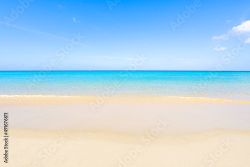 Amazing beautiful Phuket beach with wave crashing on sandy shore Thailand Landscapes view of white sand beach sea and clear blue sky in summer season At Patong Beach Phuket Thailand