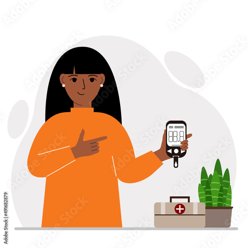 Happy woman holds a glucometer in his hand. The concept of blood sugar control, diabetic.