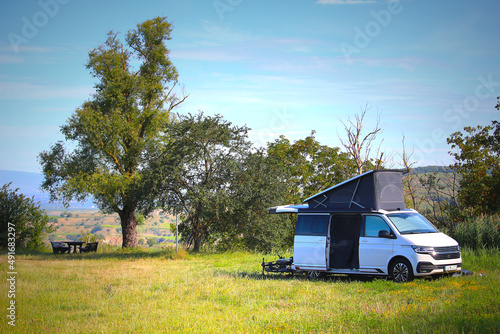 Fototapet Camping amidst greenery, holiday trip in campervan