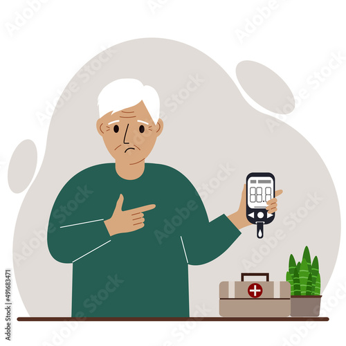 Sad old man holds a glucometer in his hand. The concept of blood sugar control, diabetic.