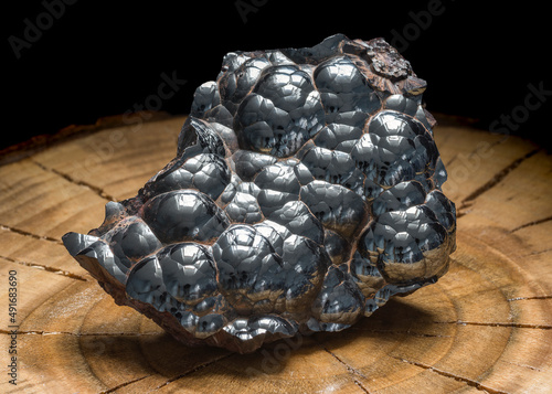Kidney resembling hematite rock with its undulated metallic surface. Botryoidal iron oxide crystal mineral. A solid mass of lustrous kidney ore hematite photo
