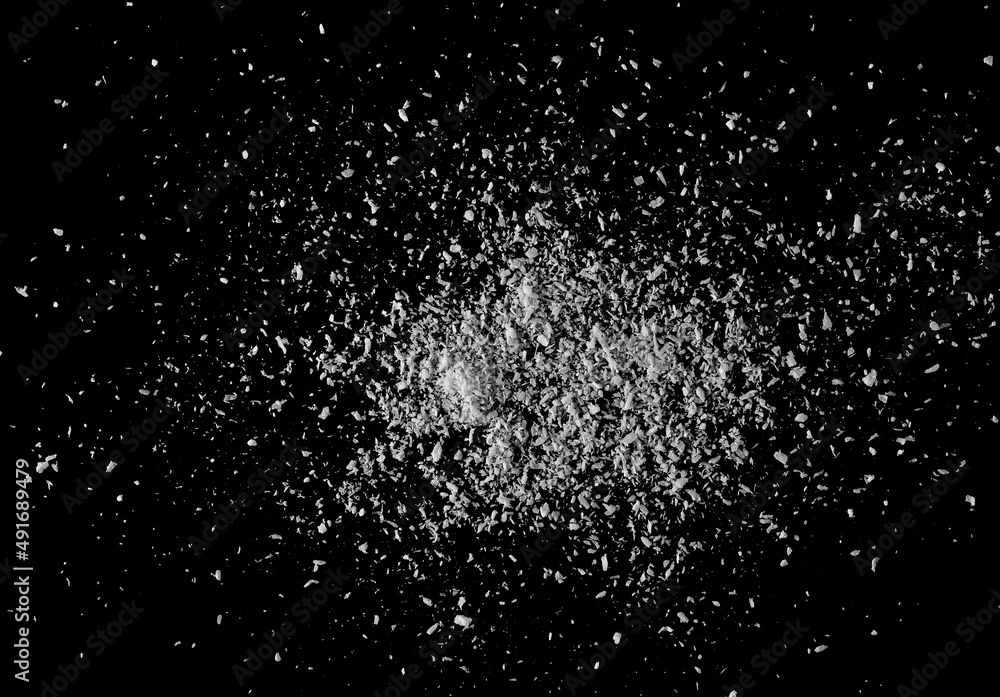 Shredded coconut meat isolated on black, top view Shredded coconut meat isolated on black, top view