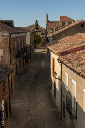 Street in the old town of the medieval village of Uruena at sunset.