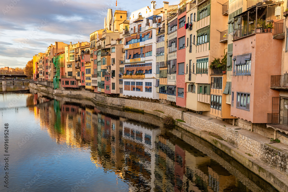 Serene canal in old city district with aged buildings Serene canal in old city district with aged buildings
