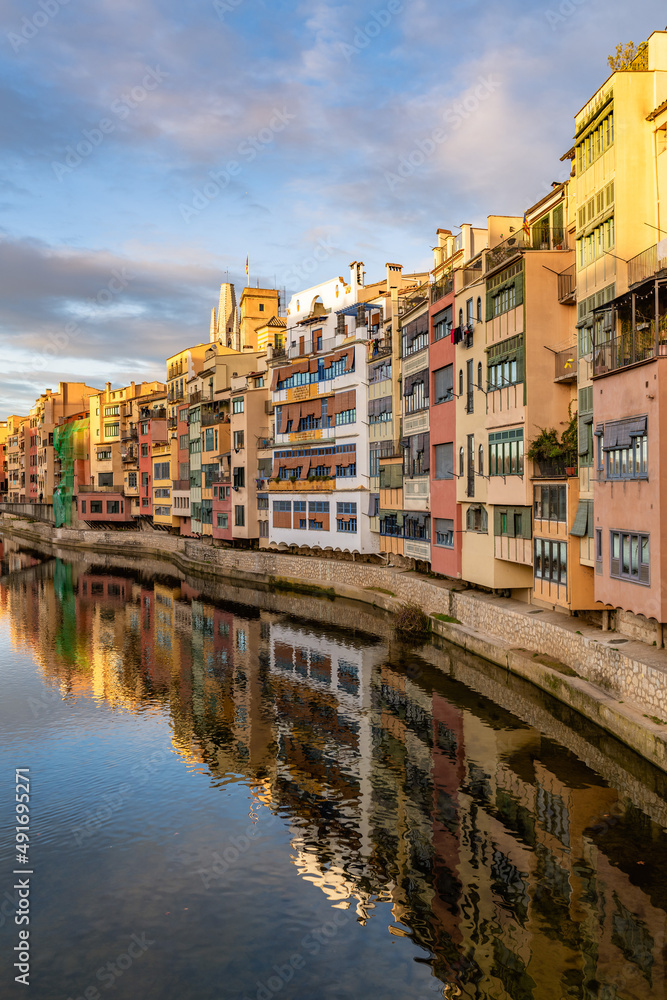 Serene canal in old city district with aged buildings Serene canal in old city district with aged buildings