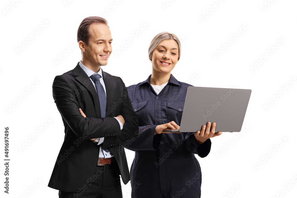 Manager and female worker looking at a laptop computer Manager and female worker looking at a laptop computer
