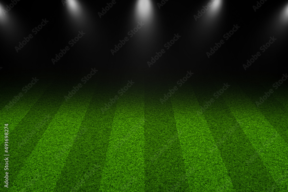Green soccer field with bright spotlights