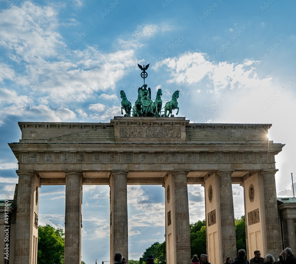 Brandenburg gate - the most famous symbol of Berlin. Sunny day and a blue sky in german capital.