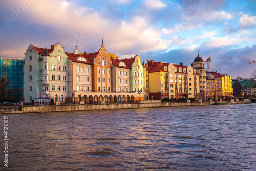Colored houses on the central embankment at sunset in Kaliningrad.
