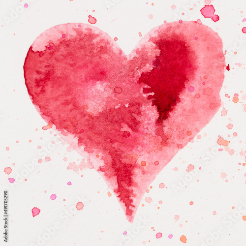 Watercolor painted pink heart, on the white watercolor paper.