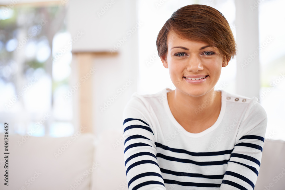 Youn cant help but stare at that stunning smile. Cropped shot of a happy young woman relaxing at home. Youn cant help but stare at that stunning smile. Cropped shot of a happy young woman relaxing at home.