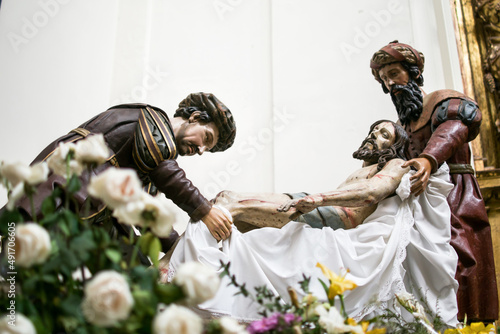 Semana Santa en Valladolid, España. Conjunto escultórico del paso de Cristo de la Cruz a María. Imágenes de Cristo muerto, Nicodemo y José de Arimatea.  photo