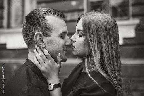 Happy couple hugging and smiling. Portrait of a guy and a girl with a smile on their faces.
