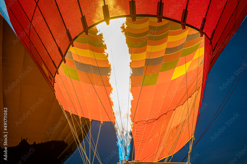 Obraz premium Morning start of a Hot air balloons (atmosphere ballons) flying over mountain landscape at Cappadocia, Turkey