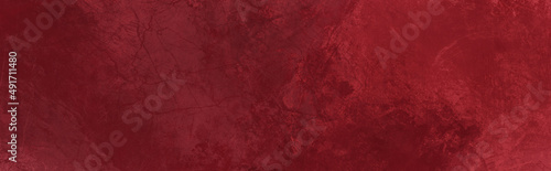 Elegant solid dark red color abstract painted grunge texture paper design background with rough paint brush stroke textured pattern in panoramic wallpaper design