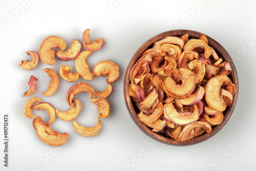 Dried apples in a bowl on white background 