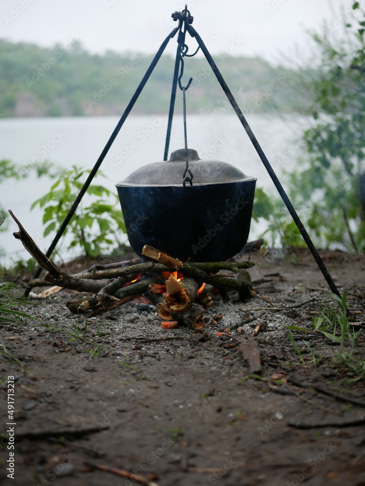 Cauldron on the fire. Cooking on fire. Cauldron on the fire. Cooking on fire.