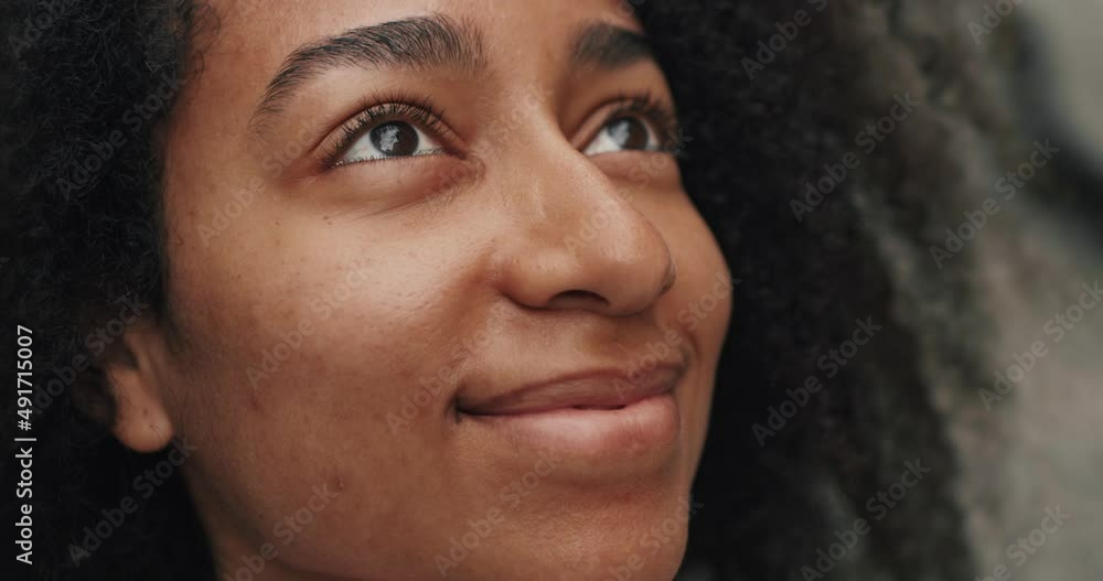 Beautiful Face of American Woman Dreamy looking up Outdoors. Sensual Ethnic Female with Pretty Face and Big Brown Eyes enjoys Nature. Having Cheerful Smile. Curly Haired Girl. Beautiful Face of American Woman Dreamy looking up Outdoors. Sensual Ethnic Female with Pretty Face and Big Brown Eyes enjoys Nature. Having Cheerful Smile. Curly Haired Girl.