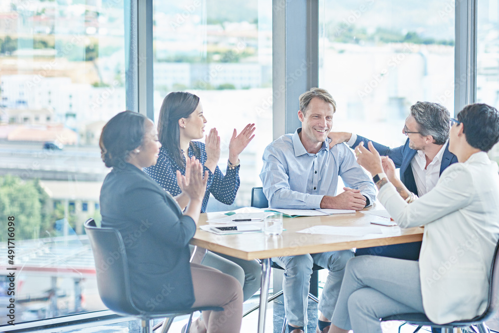 He made COO. Shot of a group of businesspeople having a meeting in a boardroom. He made COO. Shot of a group of businesspeople having a meeting in a boardroom.