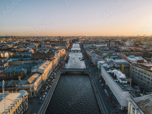 Aerial sunset cityscape of Fontanka river in Saint Petersburg, Russia. Bridges across river. Travel destination. Vacation concept.