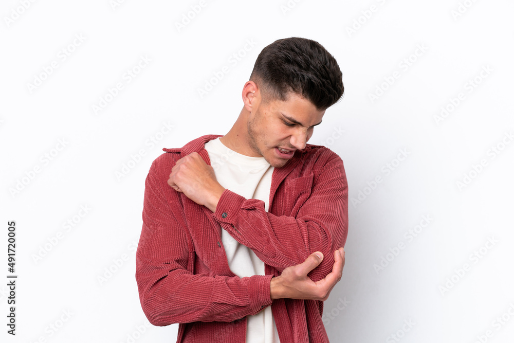 Young caucasian man isolated on white background with pain in elbow Young caucasian man isolated on white background with pain in elbow