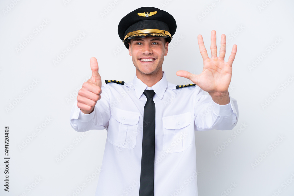 Airplane caucasian pilot isolated on white background counting six with fingers
