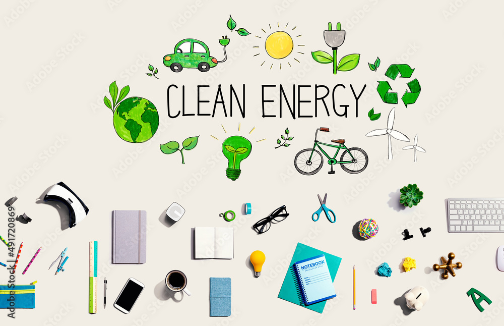 Clean energy concept with collection of electronic gadgets and office supplies Clean energy concept with collection of electronic gadgets and office supplies
