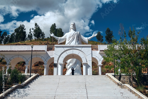 Huanta, Ayacucho, Peru - 6 of March 2021. White christ on the top of the andean mountain, huanta. photo
