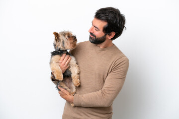 Man holding a yorkshire isolated on white background with happy expression