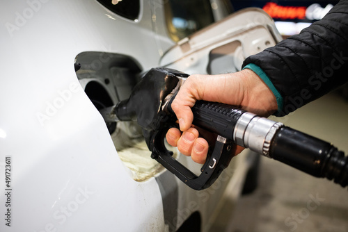 gas station putting gasoline into car oil price © Melinda Nagy