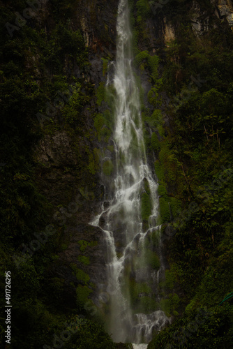 Beautiful photo of a picturesque waterfall in the jungle  green tropical forest  in the mountains  Colombia