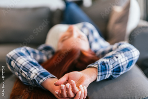 Relaxed young woman lying on the sofa