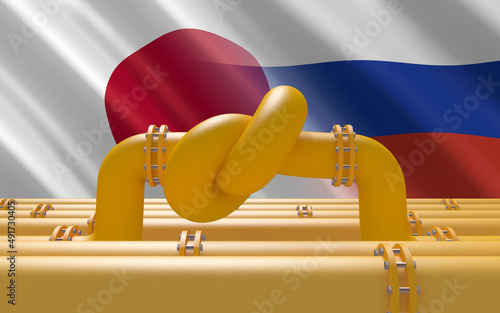 Fuel gas pipeline with a knot on background of Japanese and Russian flags. Industrial economic sanctions. Energy embargo. Oil import export from the world fuel trade market restricts. photo