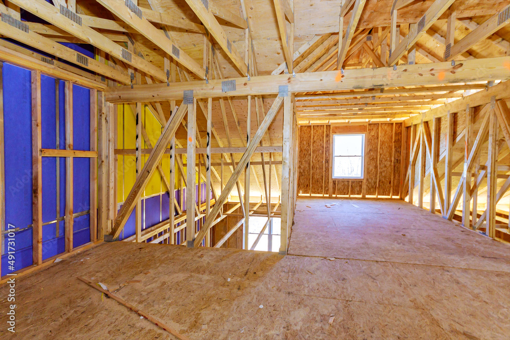 Building construction wood framing of a new house under construction Building construction wood framing of a new house under construction