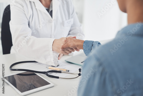 Congratulations on your recovery. Cropped shot of an unrecognizable female doctor shaking hands with a female patient in her office.