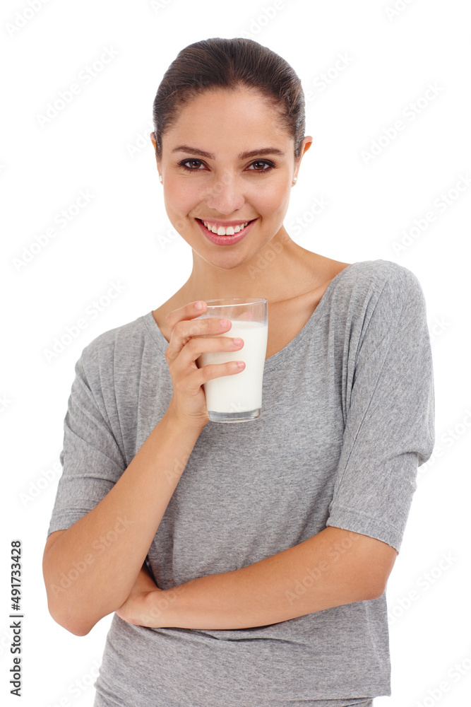 Milk for strong teeth and bones. Cropped shot of an attractive young woman holding a glass of milk. Milk for strong teeth and bones. Cropped shot of an attractive young woman holding a glass of milk.