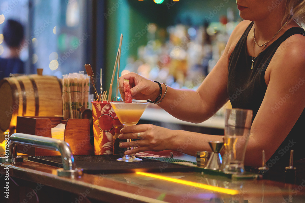 Female barman preparing drinks. cocktail bar Drinks at the bar. Fresh
