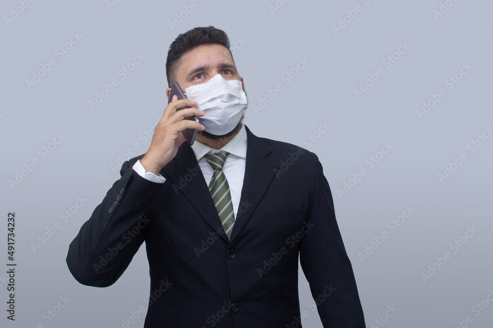 isolated businessman using mask to protect himself from viruses isolated businessman using mask to protect himself from viruses