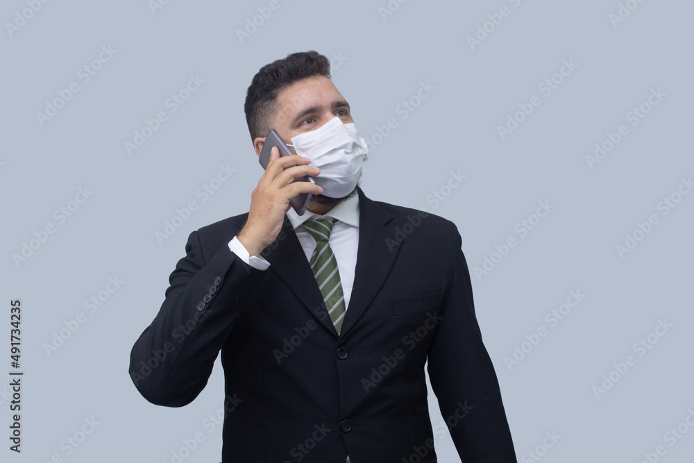 isolated businessman using mask to protect himself from viruses isolated businessman using mask to protect himself from viruses