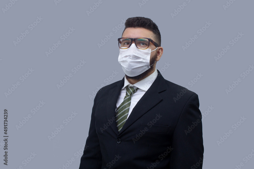 isolated businessman using mask to protect himself from viruses isolated businessman using mask to protect himself from viruses