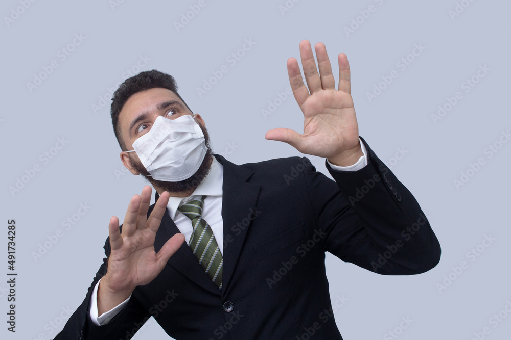 isolated businessman using mask to protect himself from viruses isolated businessman using mask to protect himself from viruses