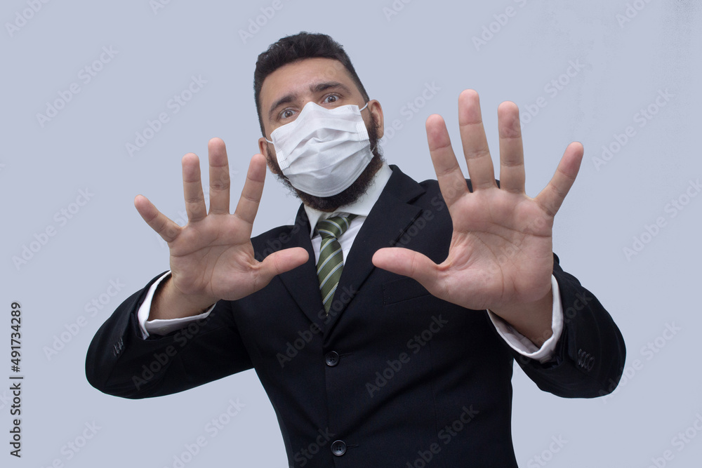 isolated businessman using mask to protect himself from viruses isolated businessman using mask to protect himself from viruses
