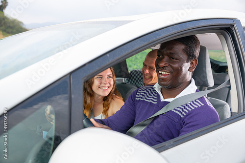 Positive friend talking in car during common trip
