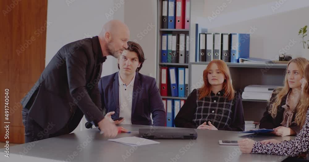 Angry businessman in meeting at office Angry businessman in meeting at office