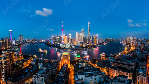 Aerial view of city skyline and modern commercial buildings in Shanghai at night, China.