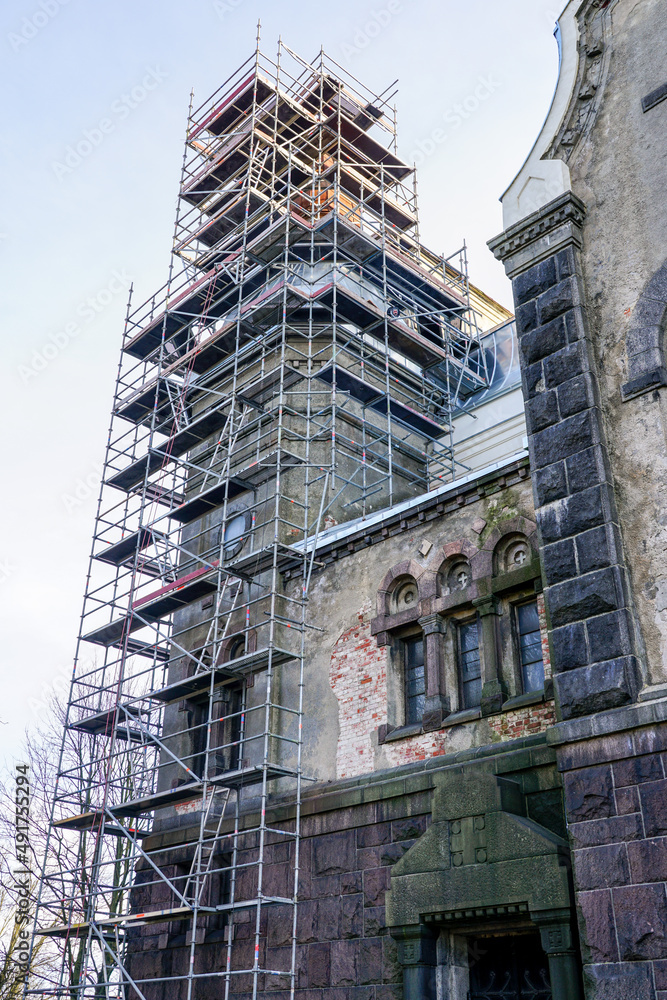 scaffolding of complex configuration for replacing the roof of a historic church tower