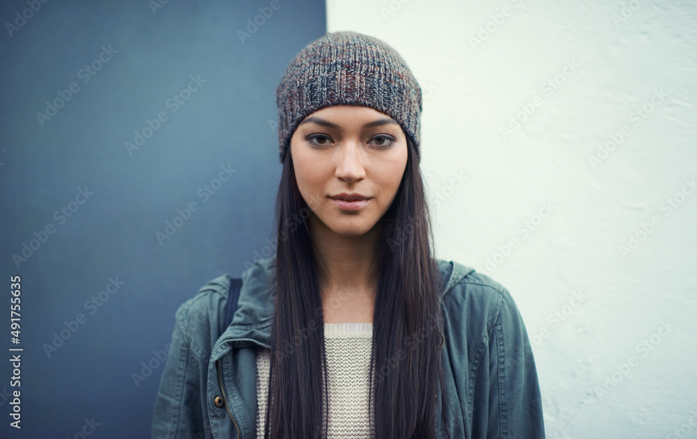 Shes a confident woman. Portrait of a young woman standing outdoors. Shes a confident woman. Portrait of a young woman standing outdoors.