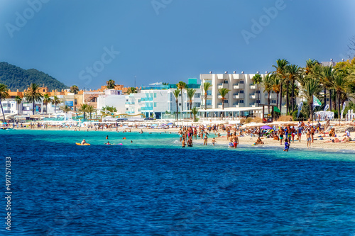 Scene from sandy beach at Ibiza during summer day.